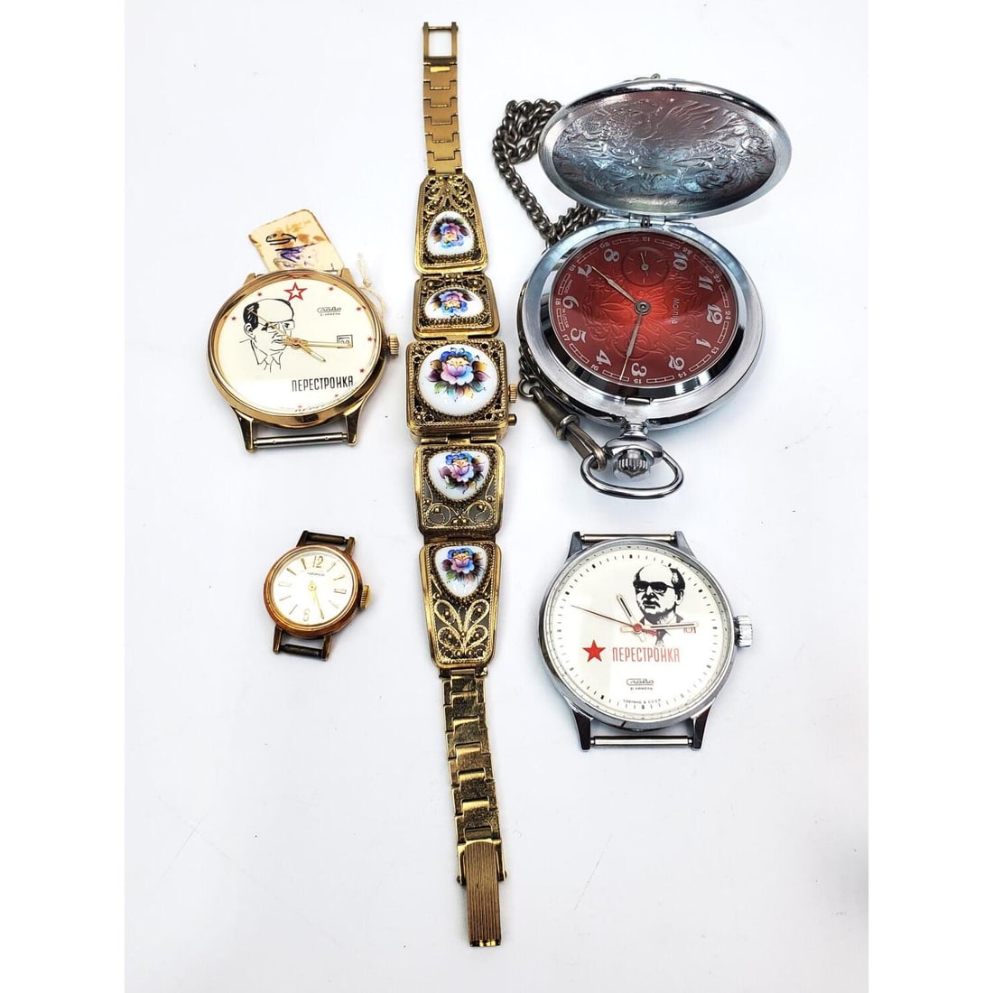 Lot of 5 Vintage Russian Watches: Lot of 5 Vintage Russian Watches Including 2 Watches Depicting Gorbachev & 1 Pocket Watch. Condition: Sold As Is. Please Note- We Do Not Guarantee the Workability or Mechanism of Any Watches or Clocks
