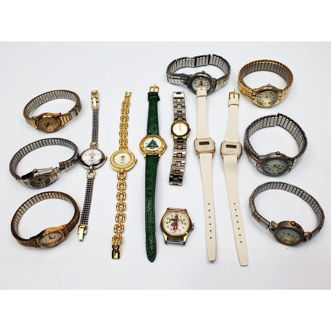 Lot of 14 Costume Watches: Lot of 14 Costume Watches. Condition: As Found. Please Note- We Do Not Guarantee the Workability or Mechanism of Any Watches or Clocks. Dimensions: Various Sizes.Provenance: From a Long Island, NY Hom