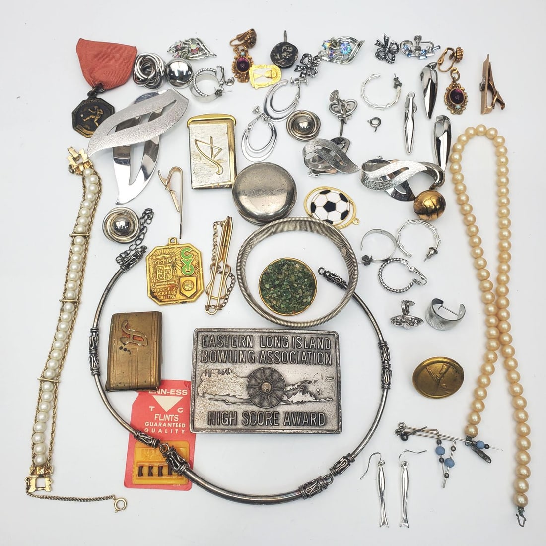 Large Group Lot of Costume Jewelry: Large Group Lot of Costume Jewelry Including Belt Buckles.Condition: Generally Good As Found. Dimensions: Various Sizes. Provenance: From a Long Island, NY Home.Please note the absence of a Condition