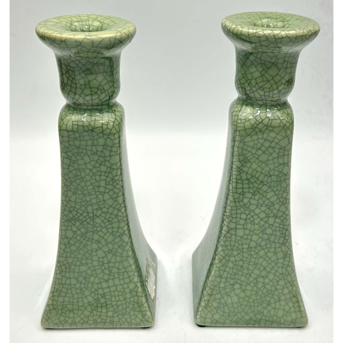 Pair of Chinese Celadon Porcelain Candlesticks: Pair of Chinese Celadon Crackle-Glazed Porcelain Candlestick Holders. Condition: Generally Very Good. Dimensions: H-8.9" Each. Provenance: From a Long Island, NY Home. Please note the absence of a Con