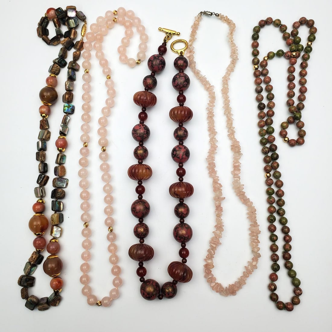 5 Vintage Jewelry Necklaces, 2 Prob. Rose Quartz: Lot of 5 Vintage Fine Jewelry Necklaces. Two are Probably Rose Quartz. Others Have Semi-Precious Stones. One Has Gold Mounts. Condition: Generally Very Good. Dimensions: Various Sizes. Longest L-38".