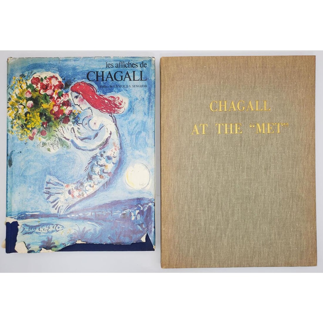 Marc Chagall (Russian/French,1887 - 1985) 2 Books: Marc Chagall (Russian/French, 1887 - 1985) Lot of 2 Books. "Chagall At The "Met"' & "Les Affiches De Chagall" Circa 1970's. Condition: Generally Very Good. Dimensions: Larger H- 12.25" x W- 10.75".
