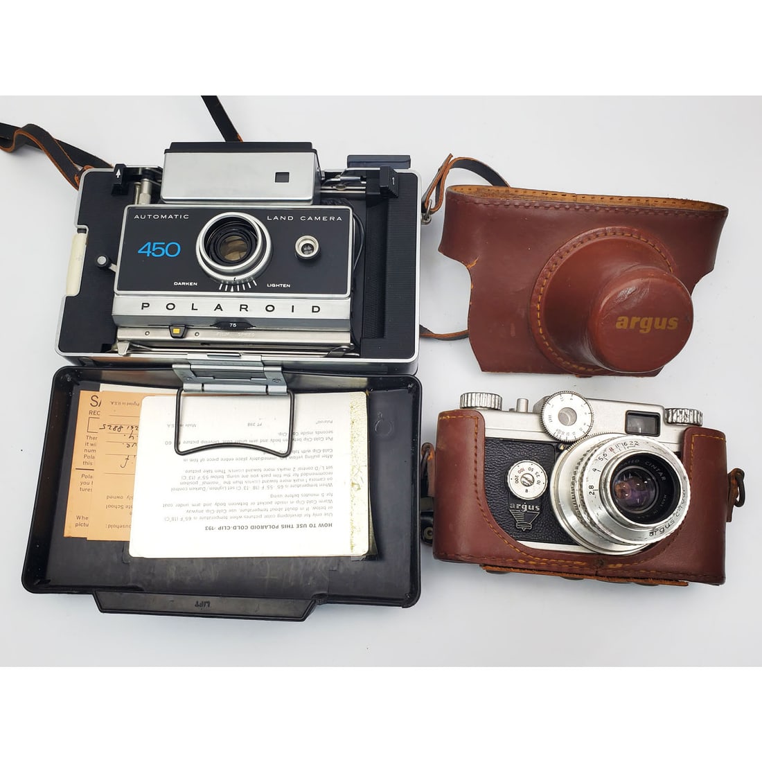 Lot of 3 Old Cameras: Lot of 3 Old Cameras Including an Argus C4 35mm Rangefinder Camera, The Polaroid 450 Electronic Timer & a Kodak Instamatic 814 w/ Ektar Lens. Condition: Generally Very Good. Please Note- We Do Not