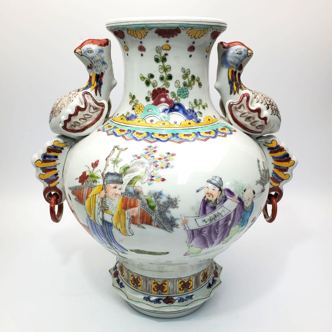 Chinese Famille Rose Porcelain Vase: Chinese Famille Rose Porcelain Vase w/ Bird Shaped Handles. Marked at the Bottom.Condition: Generally Good. 1 Wing of The Bird is Broken. Dimensions: H- 13.5" x W- 13.5". Provenance: From a Long Islan
