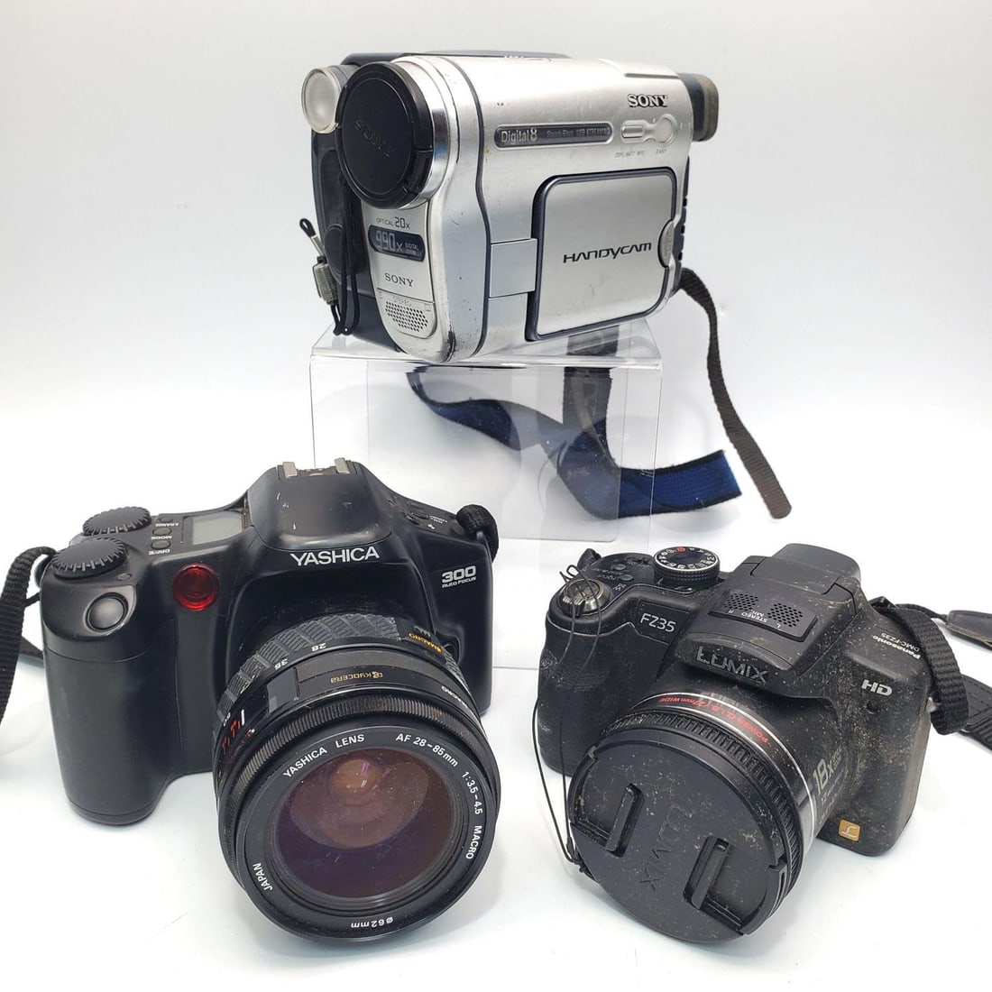 Lot of 3 Vintage Cameras: Lot of 3 Vintage Cameras Including 1 Panasonic Lumix DMC-FZ35 Digital Camera, 1 Sony DCR-TRV260 Digital8 Handycam Camcorder & 1 Yashica Auto Focus SLR Camera w/ a Yashica AF 28-85mm Macro Lens. Condit