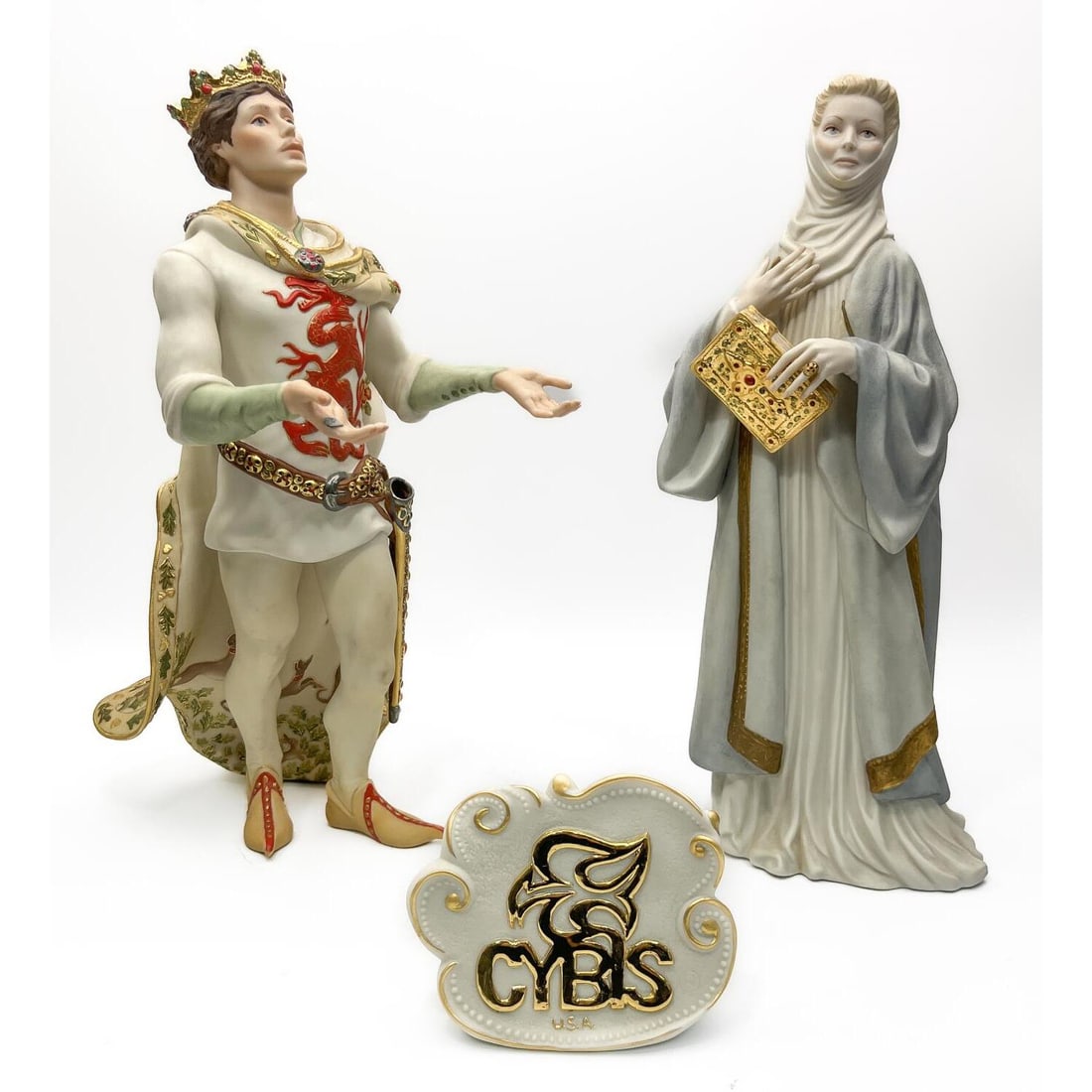 2 Limited Edition Cybis Porcelain Figures: 2 Limited Edition Cybis Bisque Hand Painted & Gilt Decorated Porcelain Figures Including "King Arthur" & "Eleanor of Aquitaine". Both Are Fully Signed & Numbered. C.1980's. Along w/ a Cybis Porcelain