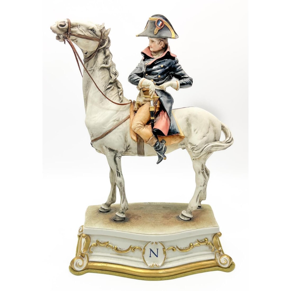 Vintage Capodimonte Porcelain Figure of Napoleon: Vintage Capodimonte Porcelain Figure of "Napoleon Bonaparte". Fully Signed. Condition: Generally Very Good. Dimensions: H-13.75" x L-9.5" x W-5". Provenance: From a Long Island, NY Estate. Please note