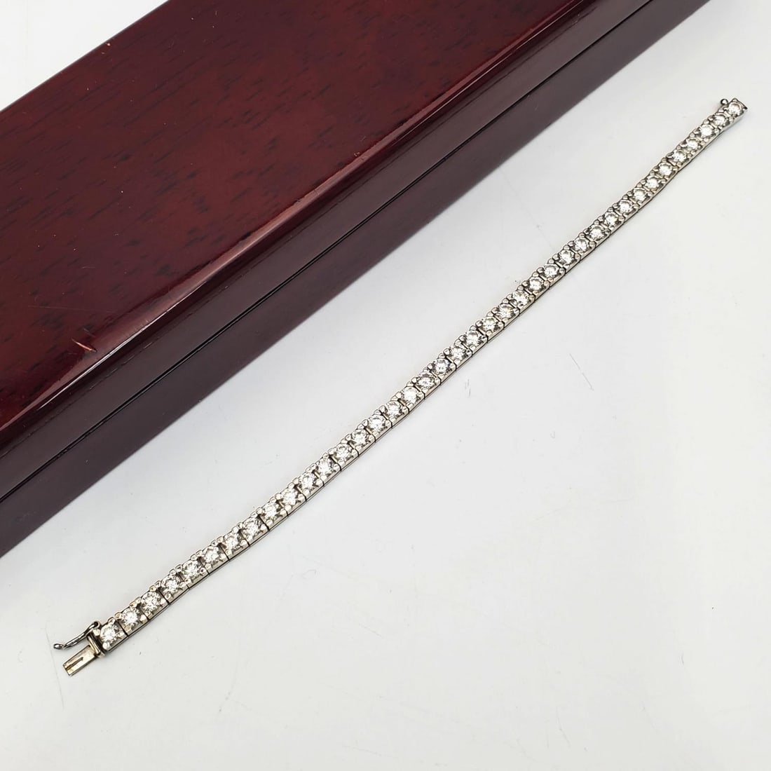 Fine 18K White Gold & Diamonds Tennis Bracelet: Exceptional 18K White Gold & Approximately 10 Carats of Good Quality Diamonds Tennis Bracelet. Condition: Excellent. Dimensions: Total L- 7.5". Gross Weight: 10.7dwt / 16.6g. Provenance: From a Long I