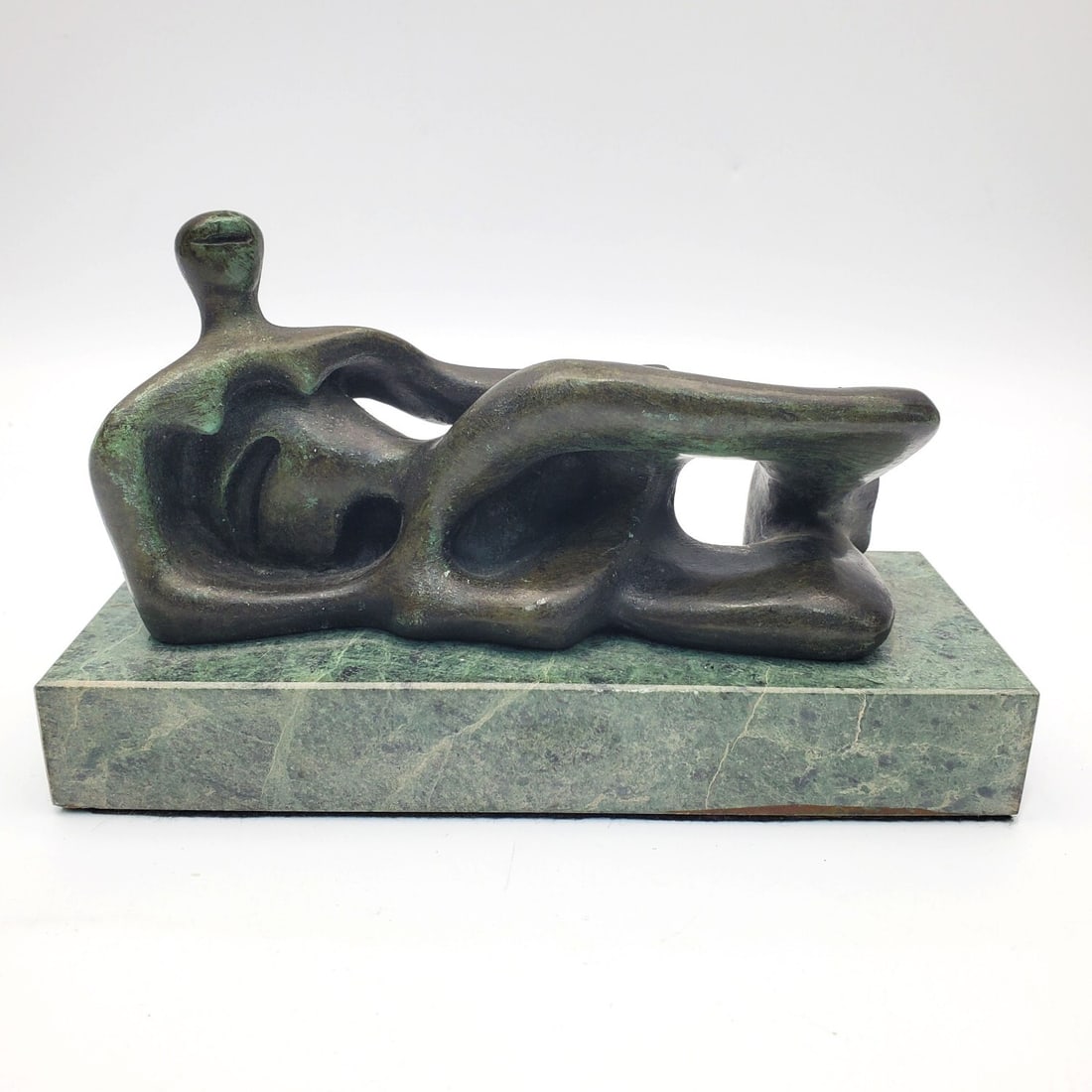 After Henry Moore, British (1831-1895) Bronze: After Henry Moore, British (1831-1895) Bronze Sculpture "Reclining Figure". Apparently Unsigned. Probably c.1970's or 80's. Mounted on Original Base. Condition: Generally Very Good. Dimensions: Bronze