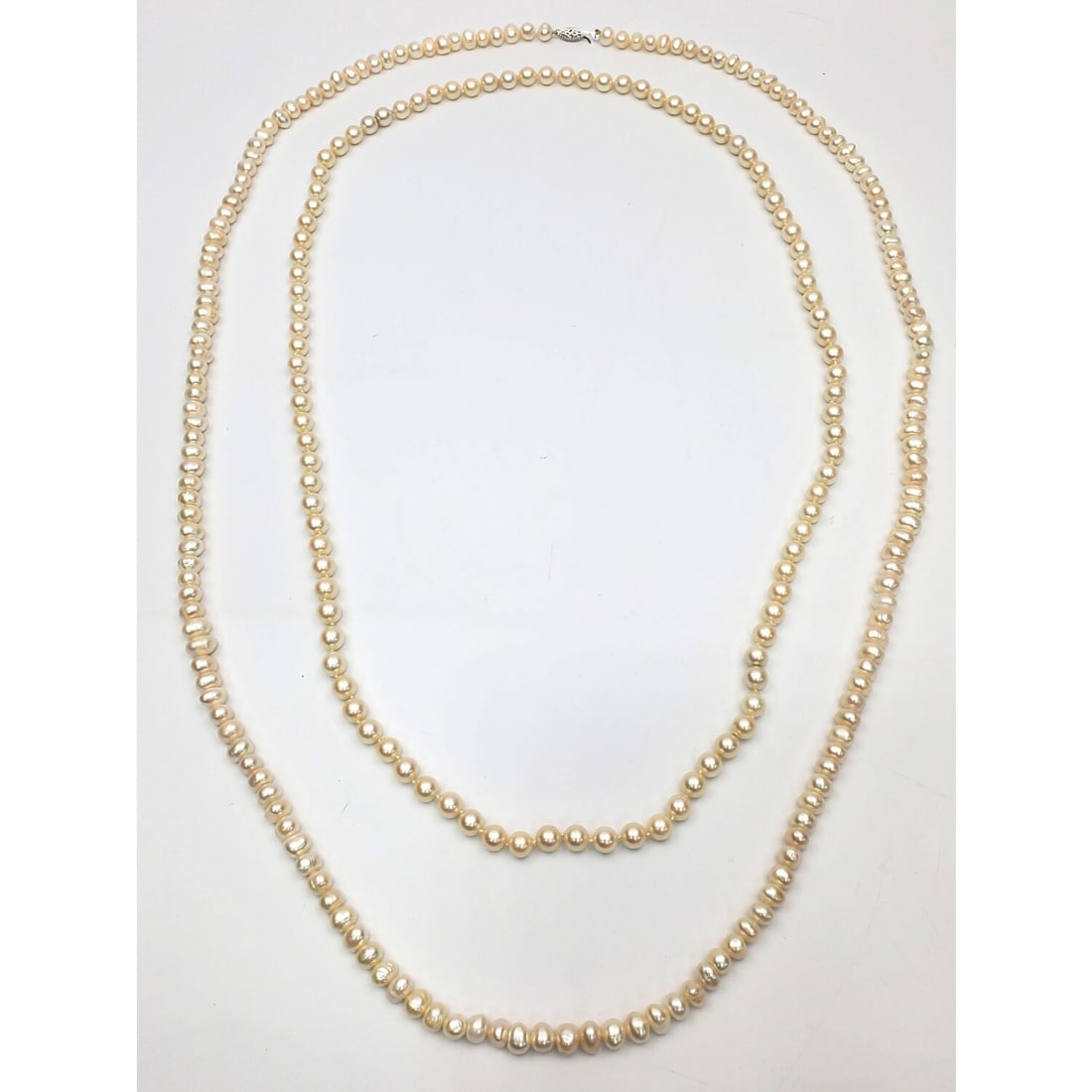 2 Vintage Pearl Necklaces. 1 w/ a White Gold Clasp: 2 Vintage Pearl Necklaces. 1 w/ a White Gold Clasp. Please Note- Due to Recent Fraudulent Activity, All Jewelry Items Purchased by New Customers Cannot Be Shipped Out Until 3 Weeks After The Auction D