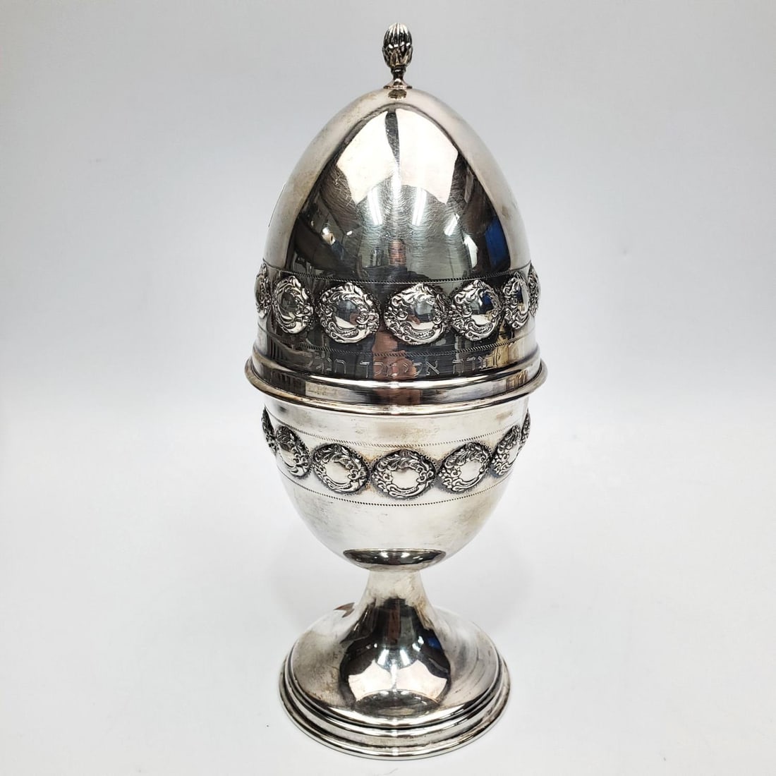 Judaica Large Sterling Silver Etrog Box in The Sha: Judaica Large Sterling Silver Etrog Box in The Shape of an Egg With Hebrew Writing. Condition: Dimensions: H- 8.25" x Dia- 9.1". Weight: 6ozt / 188.8g. Provenance: From a Long Island, NY Home. Please