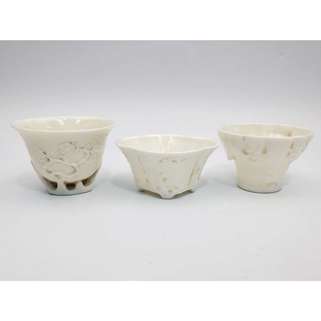 Chinese Lot of 3 Blanc De Chine Cups: Chinese Lot of 3 Blanc De Chine Cups. Condition: Generally Good. Dimensions: Tallest-H-1.8". Provenance: From a Long Island, NY Home. Please note the absence of a Condition Report does not imply that