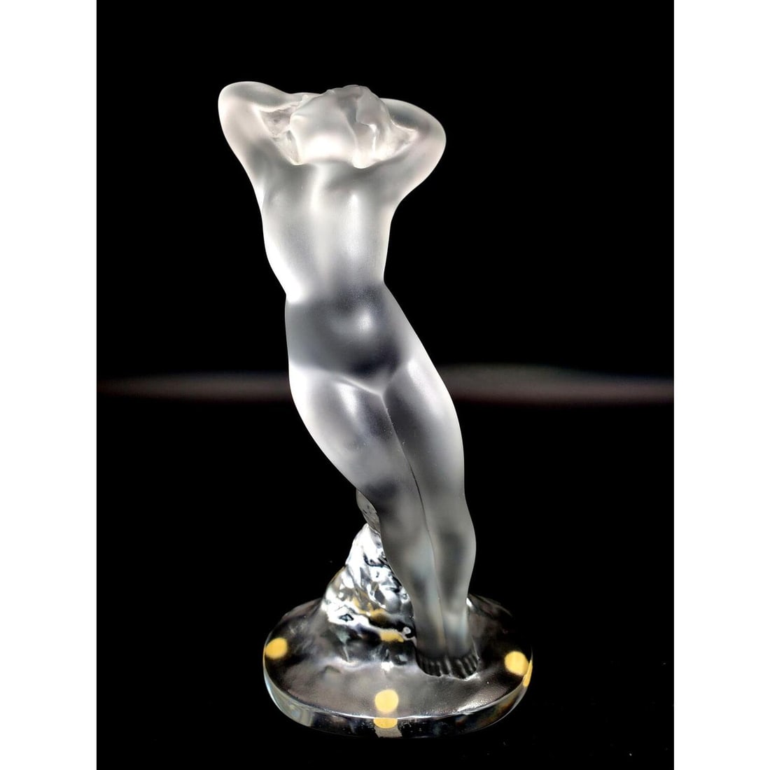Lalique "Danseuse Bras Baisse" Art Glass Figure: Lalique France "Danseuse Bras Baisse" Nude Dancer Art Glass Sculpture. Fully Marked. Condition: Excellent. Dimensions: H-9" x L-5". Provenance: From a Long Island, NY Home. Please note the absence of