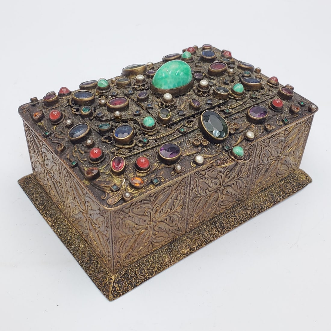 Antique Austrian Bronze Covered Box: Antique Austrian Bronze Covered Box w/ Various Semi Precious Stone Inlays. Circa 1920's. Condition: Generally Very Good. Needs Cleaning. Appears to Be Missing a Couple of Stones.Dimensions: L-5.1" x W