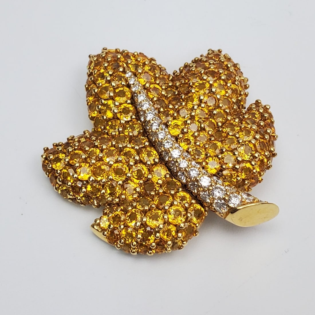"Jean Vitau" 18K Gold, Diamonds & Yellow Sapphire: Very Fine "Jean Vitau" 18K Gold, Diamonds & Yellow Sapphires Brooch. Fully Hallmarked. Condition: Excellent. Dimensions: 1.6" x 1.5". Gross Weight: 14.5dwt / 22.5g. Provenance: From a Long Island, NY