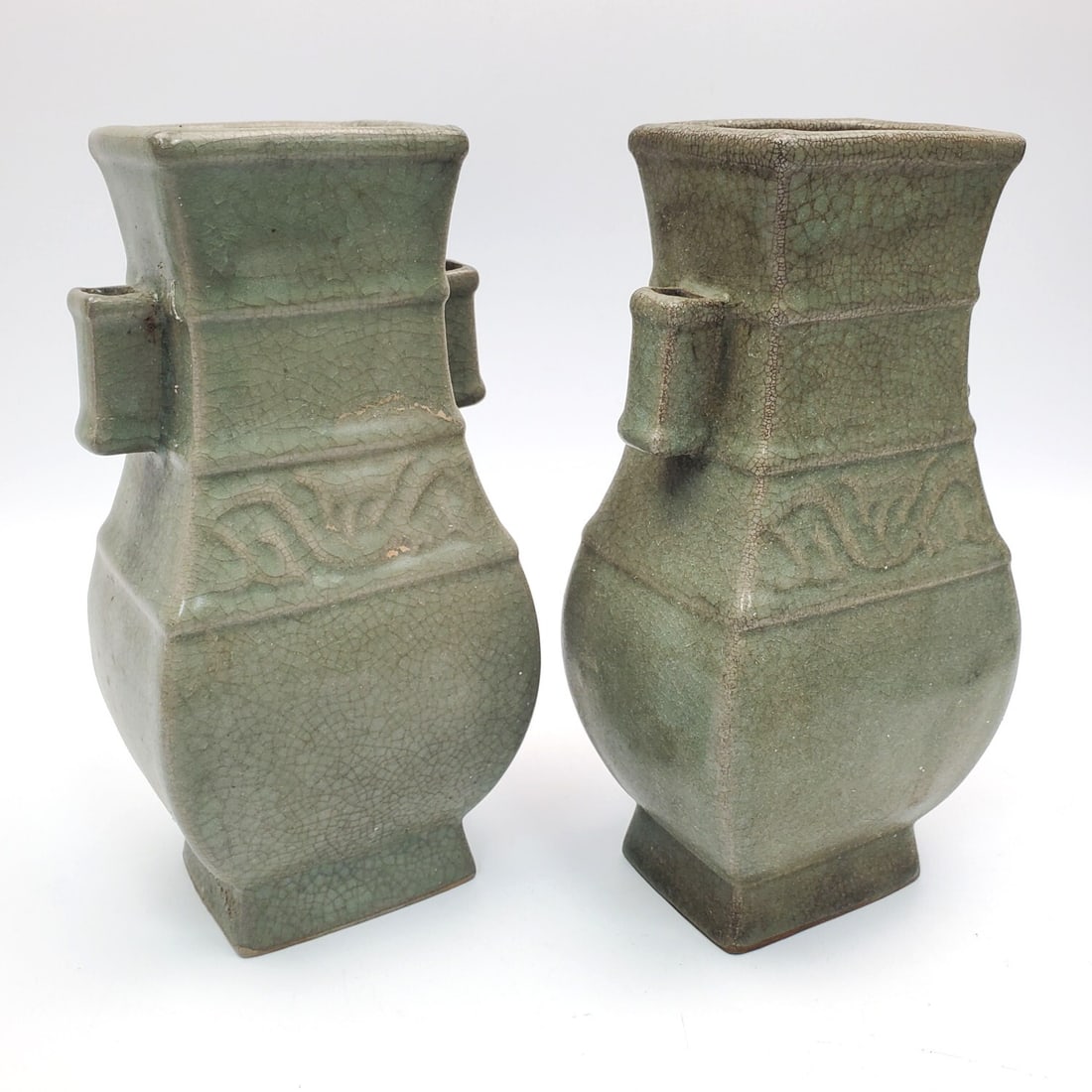 Pair of Chinese Green Celadon Porcelain Vases: Pair of Chinese Green Celadon Porcelain Vases. Condition: Generally Good. Dimensions: H-9" Each. Provenance: From a Long Island, NY Home. Please note the absence of a Condition Report does not imply t