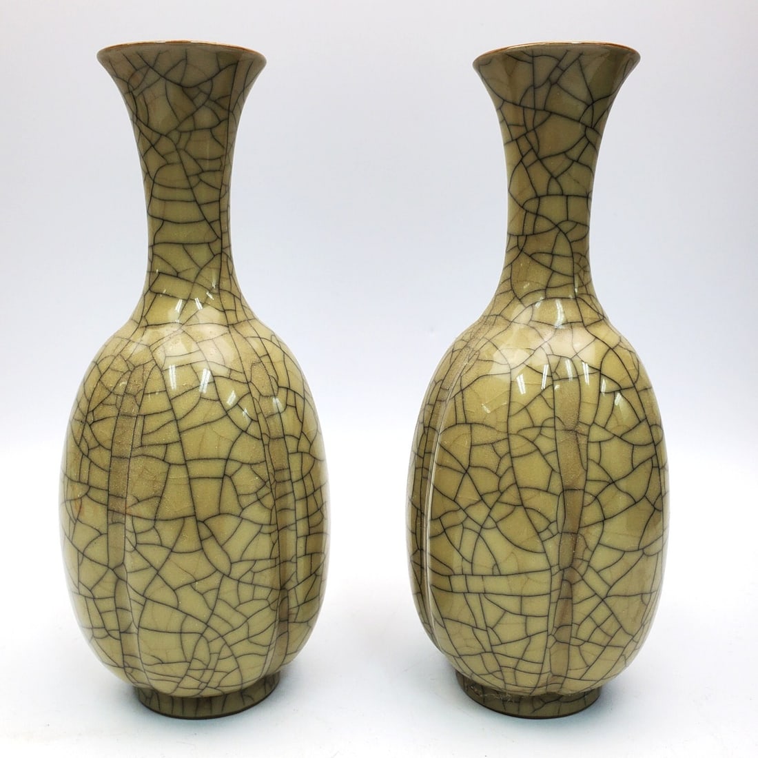 Pair of Chinese Ge-Ware Celadon Porcelain Vases: Pair of Chinese Ge-Ware Celadon Porcelain Vases. Condition: Generally Good. Dimensions: H-8.6" Each. Provenance: From a Long Island, NY Home. Please note the absence of a Condition Report does not imp