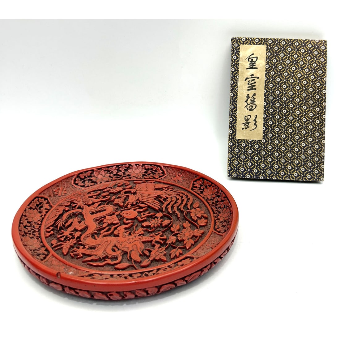 2 Chinese Items Including a Plate & an Album: 2 Chinese Items Including a Plate & an Album. Condition: Generally Good. Dimensions: Plate Dia- 7.9". Provenance: From a Long Island, NY Home. Please note the absence of a Condition Report does not im
