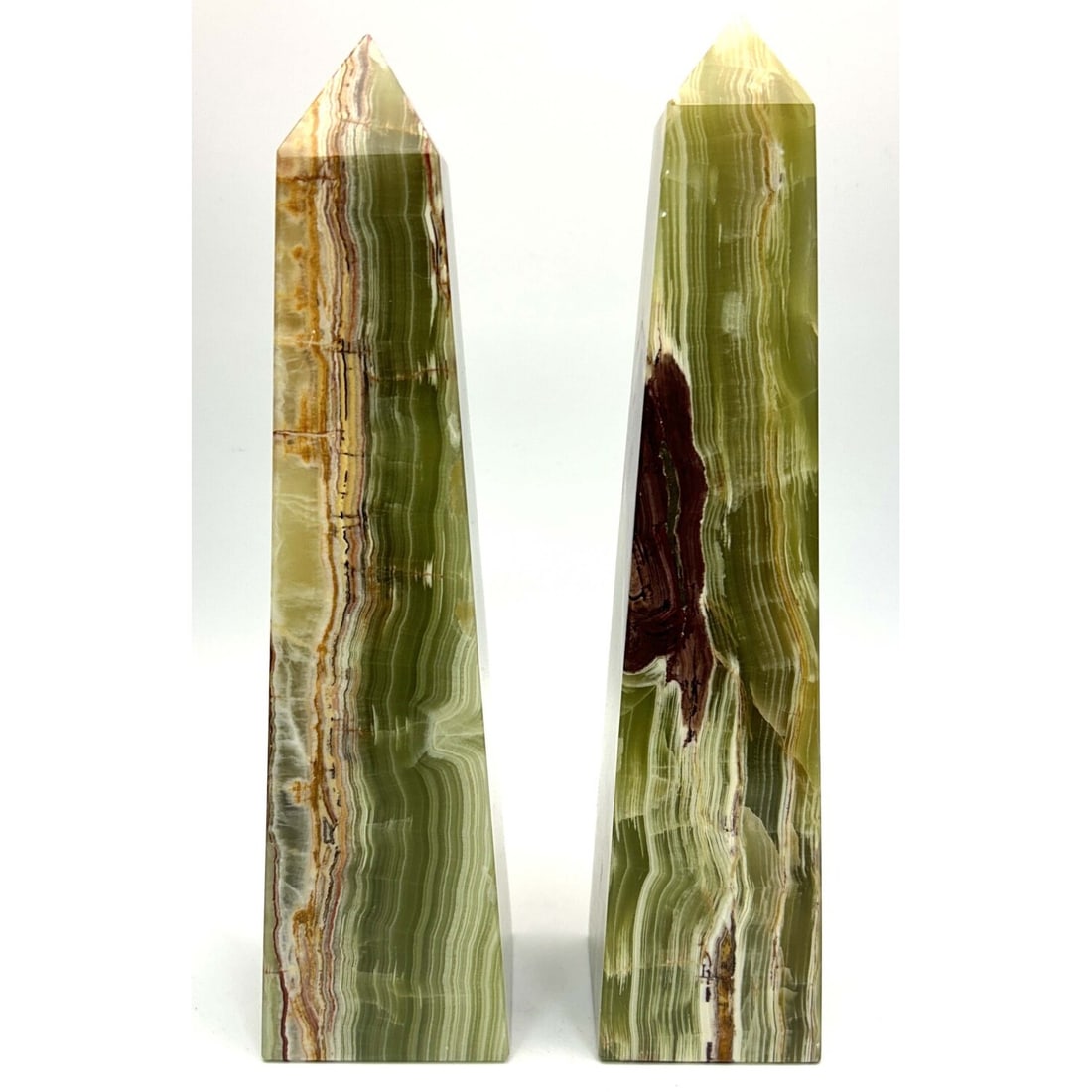Lot of 2 Green Onyx Tower Obelsks: Lot of 2 Green Onyx Tower Obelsks. Condition: Generally Very Good. Dimensions: Larger H- 12.25" x W- 3". Provenance: From a Long Island, NY Home. Please note the absence of a Condition Report does not