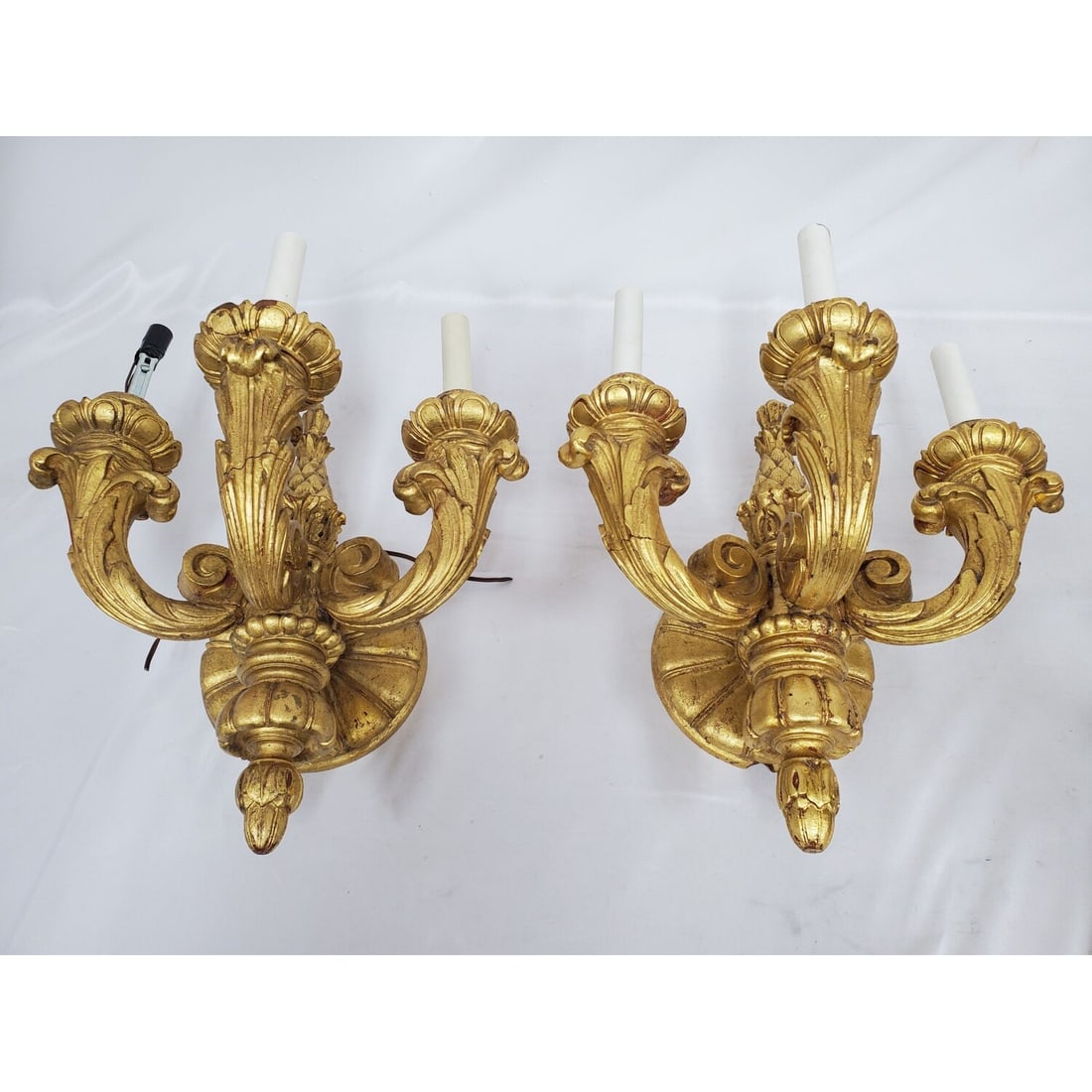 Pair of Antique French Gilt Wood Wall Sconces: Pair of Antique French Carved Gilt Wood Louis XVI Style 3 Light Wall Sconces c. Late 18th C. Condition: Generally Good. There Are Some Separations to the Wood Due To Age. One Sconce is Missing a Sleev