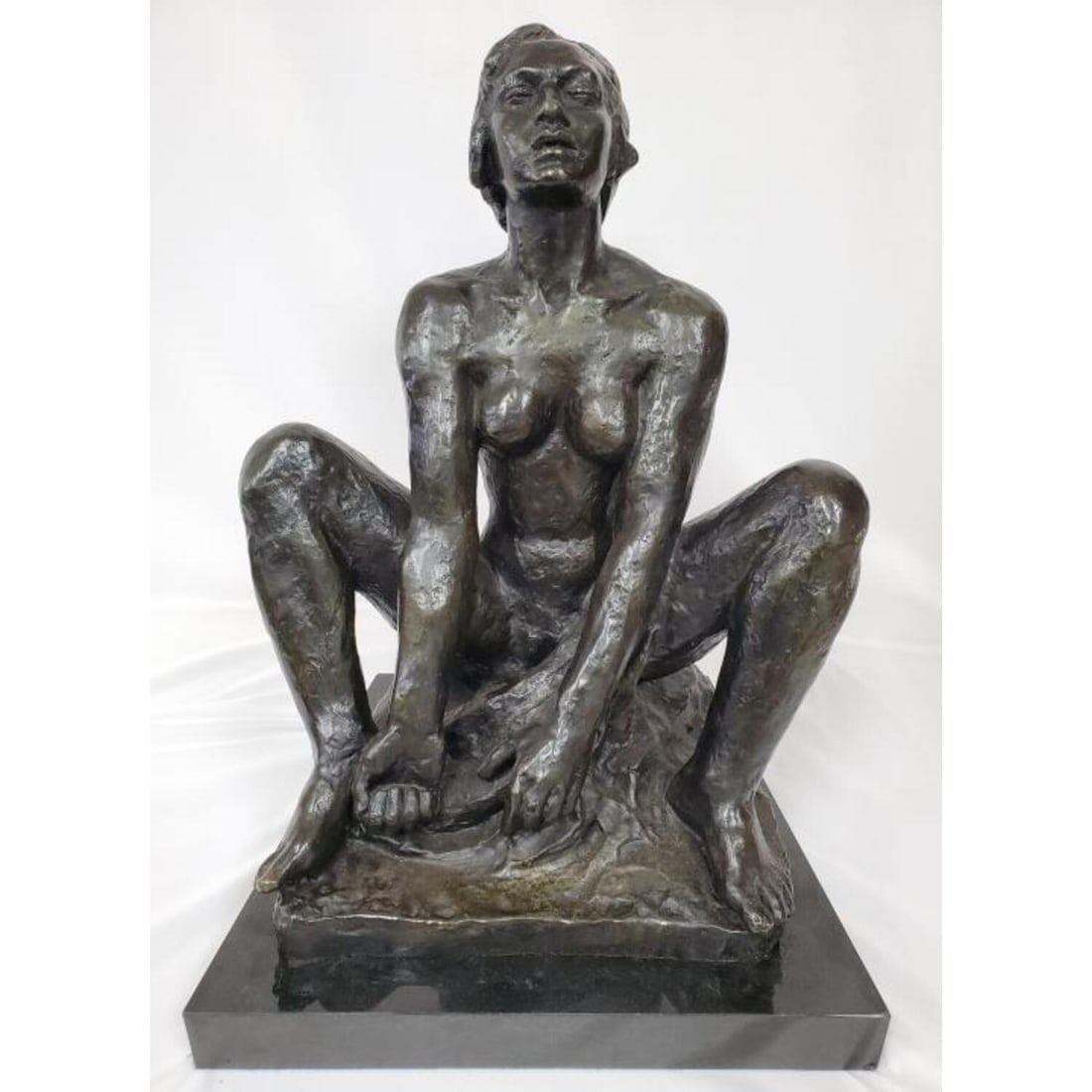 After George Kolbe, German (1877-1947) Bronze: After George Kolbe (German, 1877-1947) Large Bronze Figure Mounted on Black Marble. Signed and Numbered on the Back. Condition: Excellent. Dimensions: H- 20.5", W-17.5", Depth- 12.5", Total H w/ Base-
