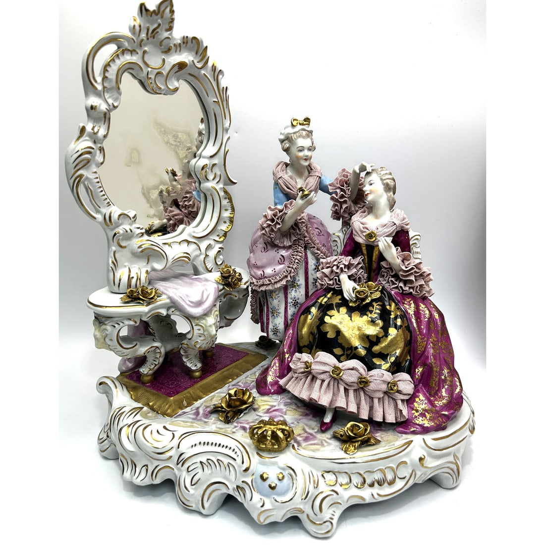 Vintage Dresden Large Porcelain Sculpture w/ Lace: Vintage Dresden Large Porcelain Group Sculpture Depicting 2 Elegant Ladies In Front of a Vanity Mirror w/ Lace Decorated Dresses. Fully Marked. Condition: Generally Very Good. Dimensions: L-14" x W-9"