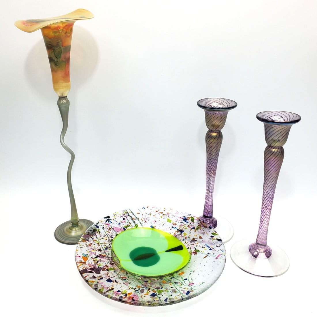Lot of 4 Art Glass Items: Lot of 4 Art Glass Items Including a Pair of Robert Held Iridescent Glass Candle Sticks Fully Signed w/ Original Stickers, a Dish & a Tall Candle Holder. Condition: All Generally Very Good. Dimensions
