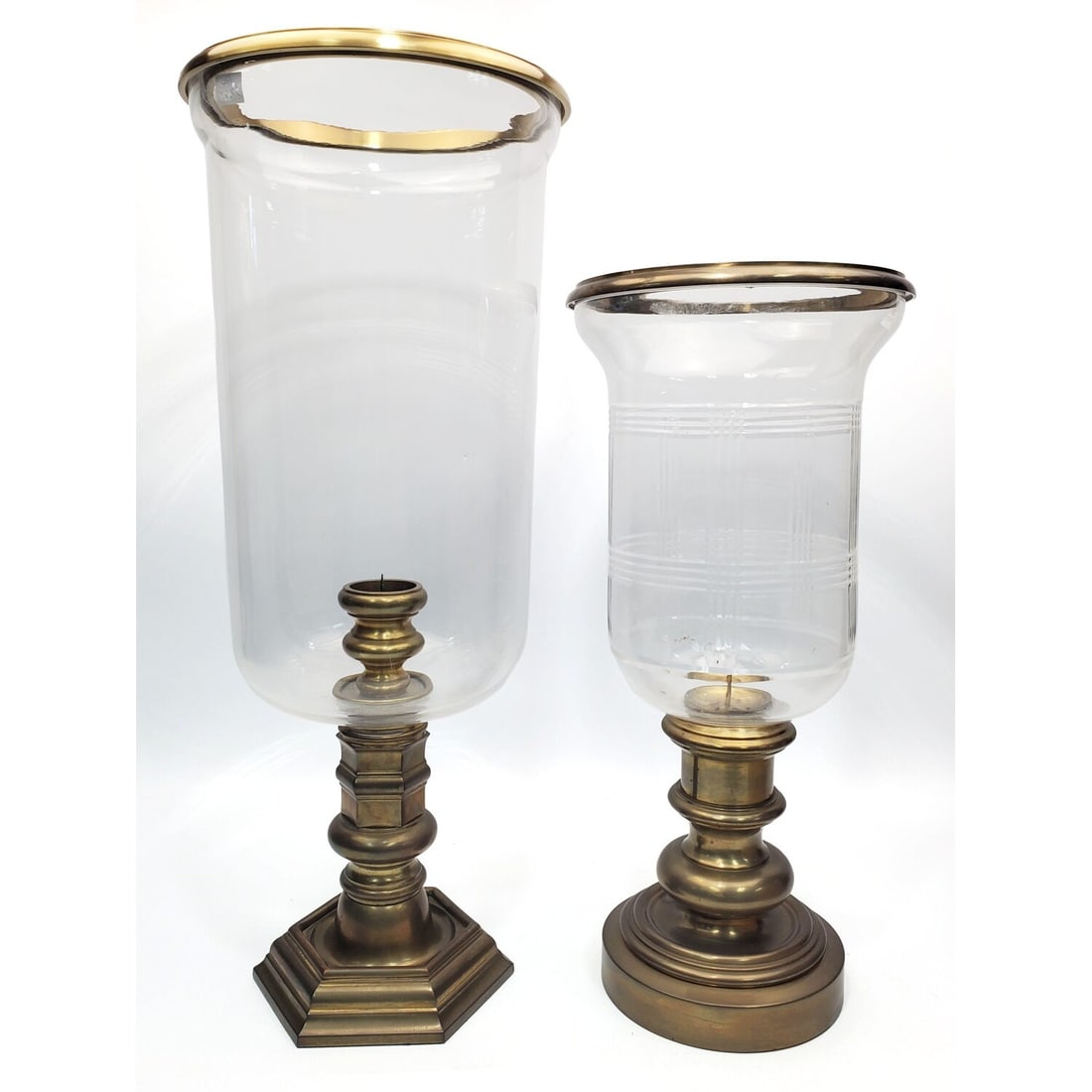 2 Ralph Lauren Brass & Glass Hurricane Candle: 2 Vintage Ralph Lauren Brass & Glass Hurricane Candle Holders w/ Original Glass Tops. Condition: Generally Very Good. Dimensions: Larger-H-20.5" x Dia-8". Provenance: From a NYC Apartment. Please note