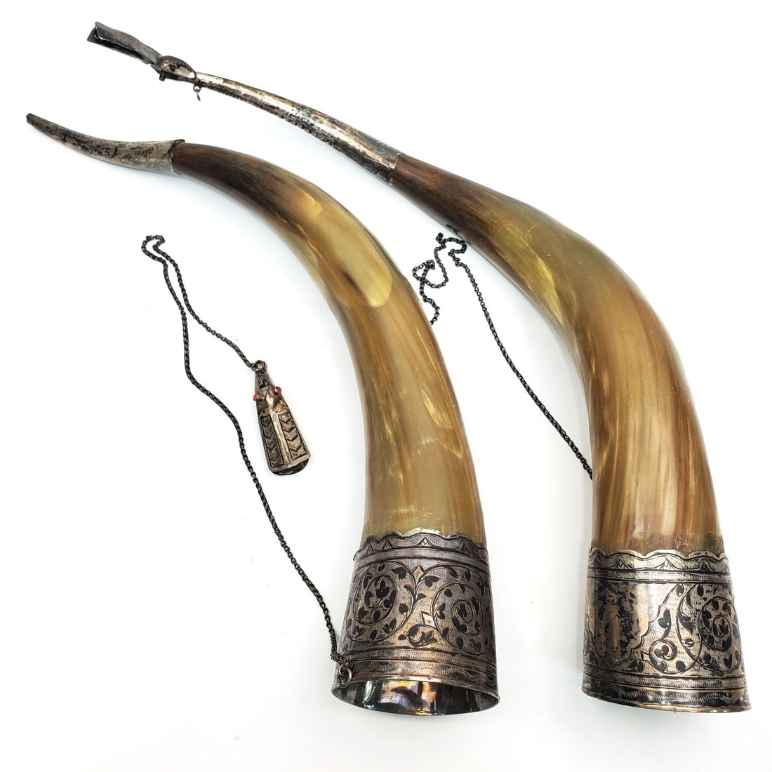 2 Russian Caucasian Silver Niello Drinking Horns: 2 Large Russian Caucasian Silver Niello Drinking Horns "Kantsi". Condition: Generally Good. As Found. Dimensions: L- 19" Each. Provenance: From a Long Island, NY Home. Please note the absence of a Con
