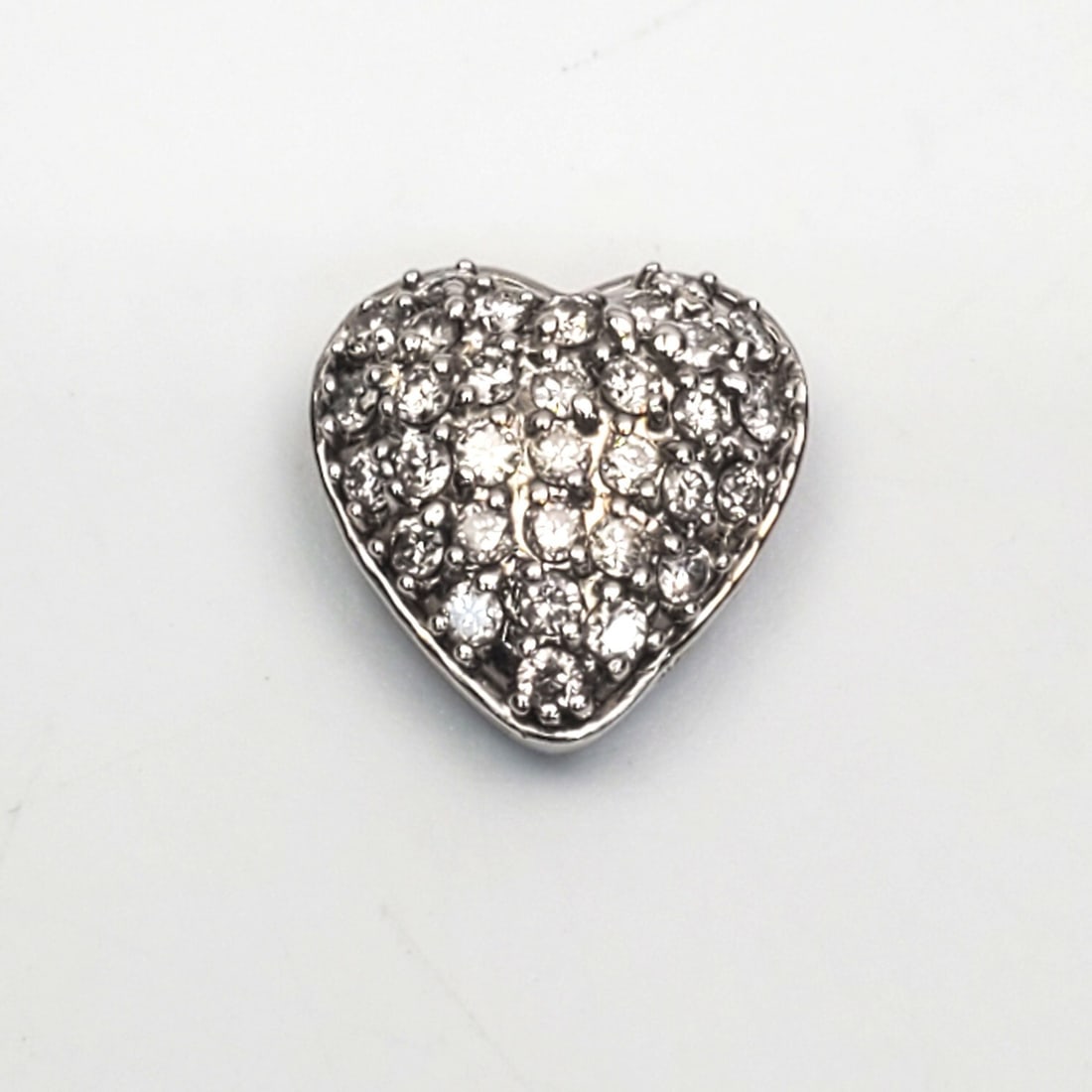 14K White Gold & Diamond Heart Pendant: 14K White Gold & Diamond Heart Pendant. Please Note- Due to Recent Fraudulent Activity, All Jewelry Items Purchased by New Customers Cannot Be Shipped Out Until 3 Weeks After The Auction Date. Conditi