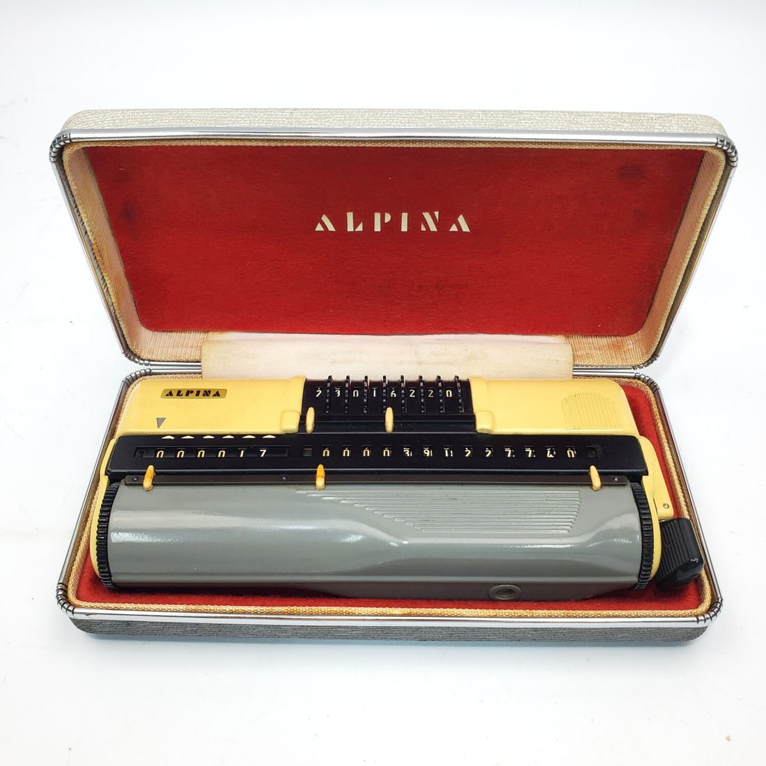 Vintage Alpina Portable Mechanical Calculator: Vintage Alpina Portable Mechanical Calculator. Made in Germany c.1961. In Original Fitted Box. Condition: As Found. Dimensions: Box-L-7.25" x W-3.75" x H-1.5". Provenance: From a Long Island, NY Home.
