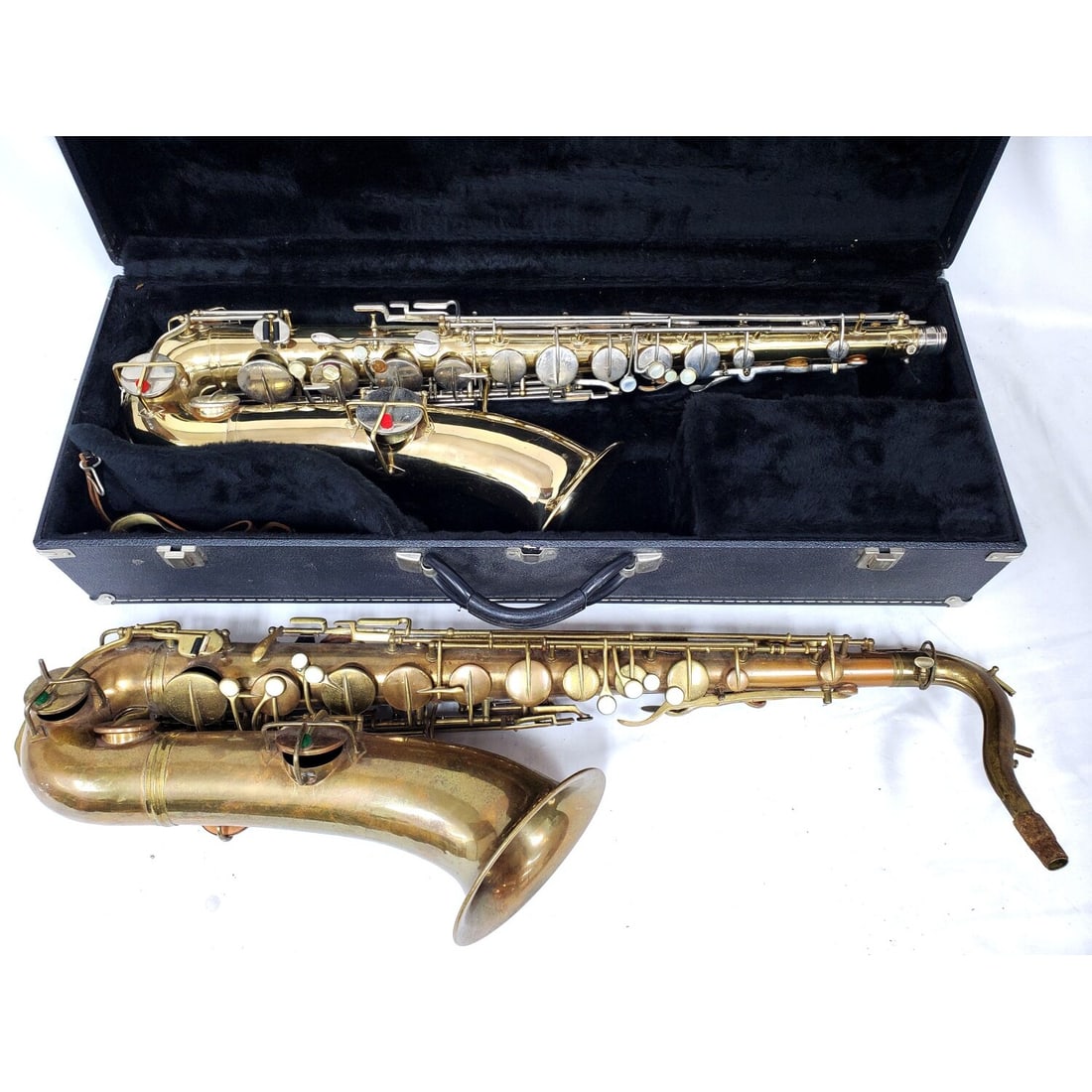 Wurlitzer Tenor Saxophone c.1940's: Wurlitzer Tenor Saxophone c.1940's. In a Fitted Box w/ 2 Mouth Pieces. Along w/ Another Saxophone. Condition: Generally Good. Re Lacquered. As Found. Dimensions: Box-L-32" x W-12" x H-7". Provenance: 