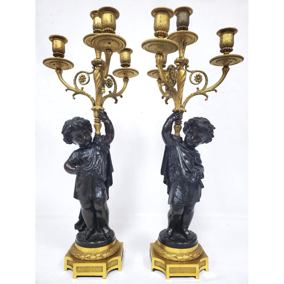 Fine Pair of French Bronze Putti Candelabras: Fine Pair of French Bronze Putti Candelabras Circa Late 19th/Early 20th C. Very High Quality Bronze. Condition: Generally Very Good. Dimensions: Both H-23" x Dia-10". Provenance: From a Long Island, N