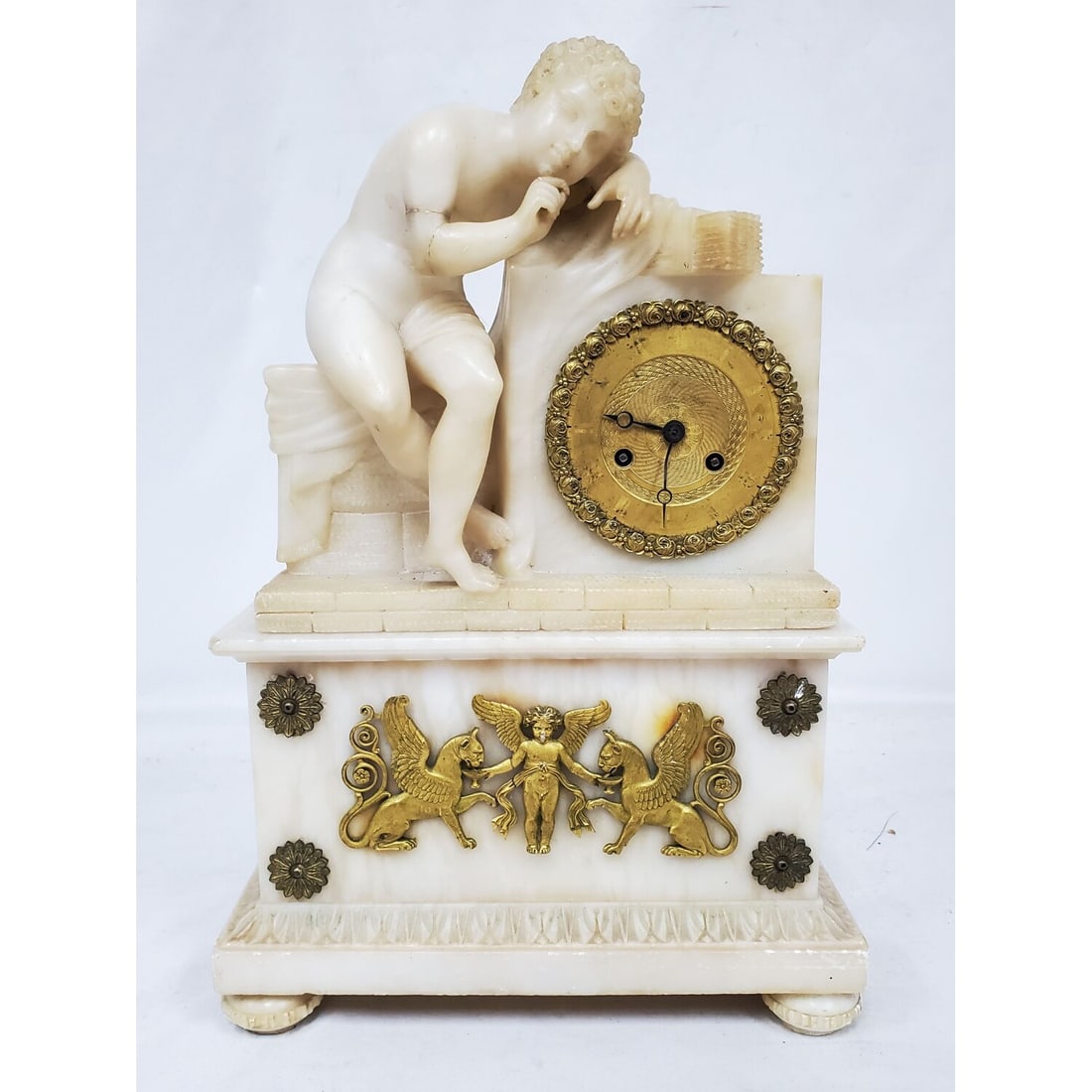 Early Antique French Empire Louis XVI Mantel Clock: Early Antique French Empire Louis XVI Mantel Clock Made of Alabaster & Dore Bonze c. Mid 19th C. Condition: Generally Good. The Cherubs Right Hand Has Restoration & 1 Finger is Missing. As Found. Plea