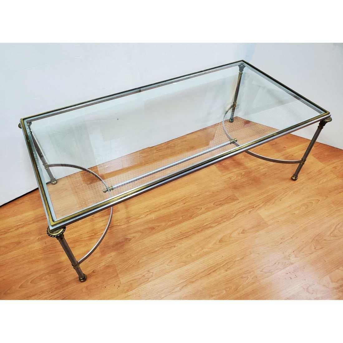 Maison Jansen Style Mid Century Coffee Table: Maison Jansen Style Mid Century Nickel & Brass Coffee Table w/ a Glass Top. Condition: Generally Very Good. Dimensions: L- 48" x W- 24" x H- 17". Provenance: From a Long Island, NY Home. Please note t