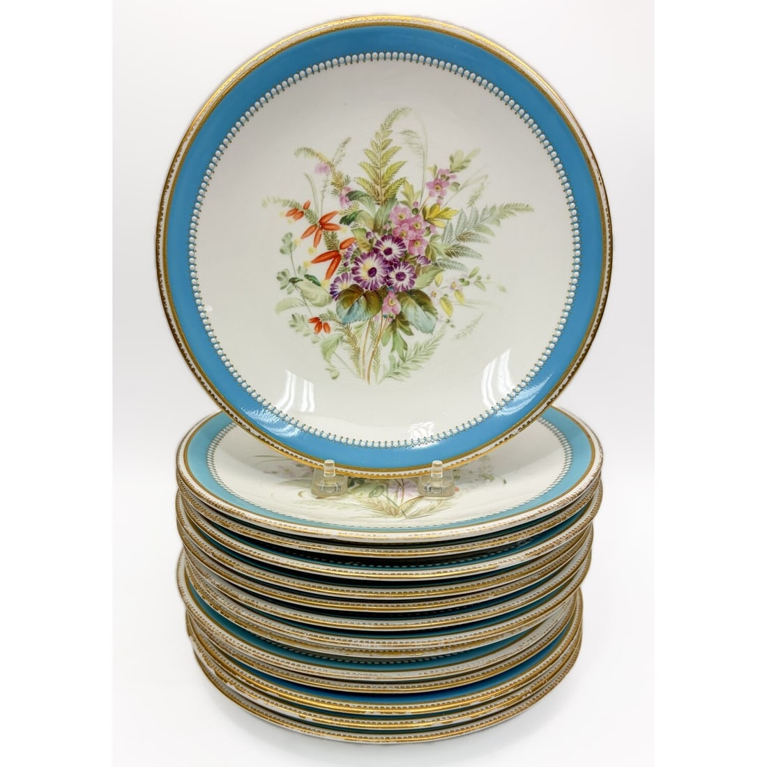 14 Antique Royal Worcester Floral Plates c.1875: Lot of 14 Antique Royal Worcester Floral Plates c.1875. Fully Marked & Numbered 9808. Condition: Generally Good w/ Losses to The Gilt Decoration on The Edges. Dimensions: Dia-9.25". Provenance: From a