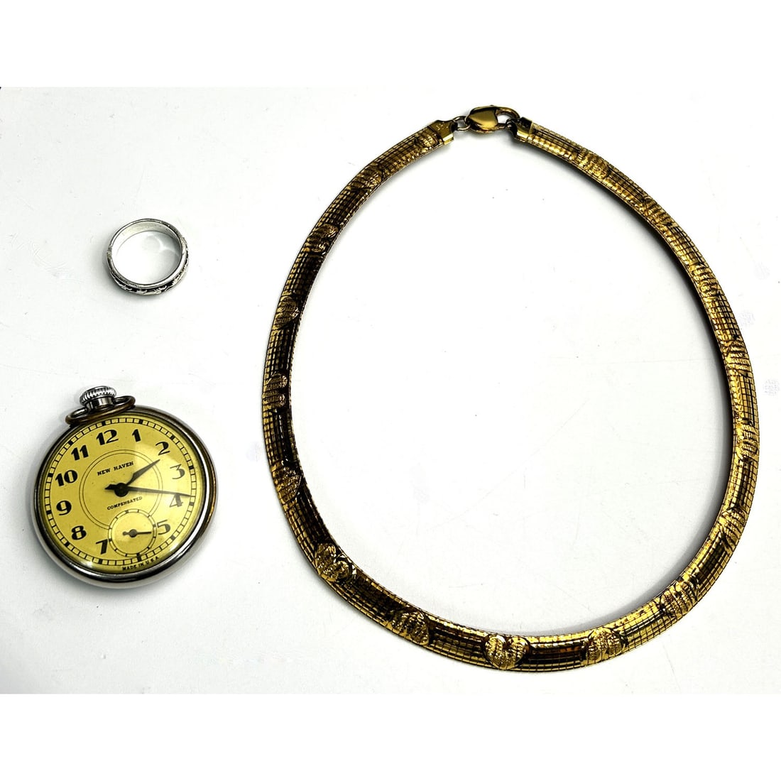 2 Sterling Silver Jewelry Items: 2 Sterling Silver Jewelry Items Including a Gilt Necklace Made in Italy & a Ring. Along w/ a New Haven Pocket Watch. Condition: Generally Good. Please Note- We Do Not Guarantee the Workability of Any 