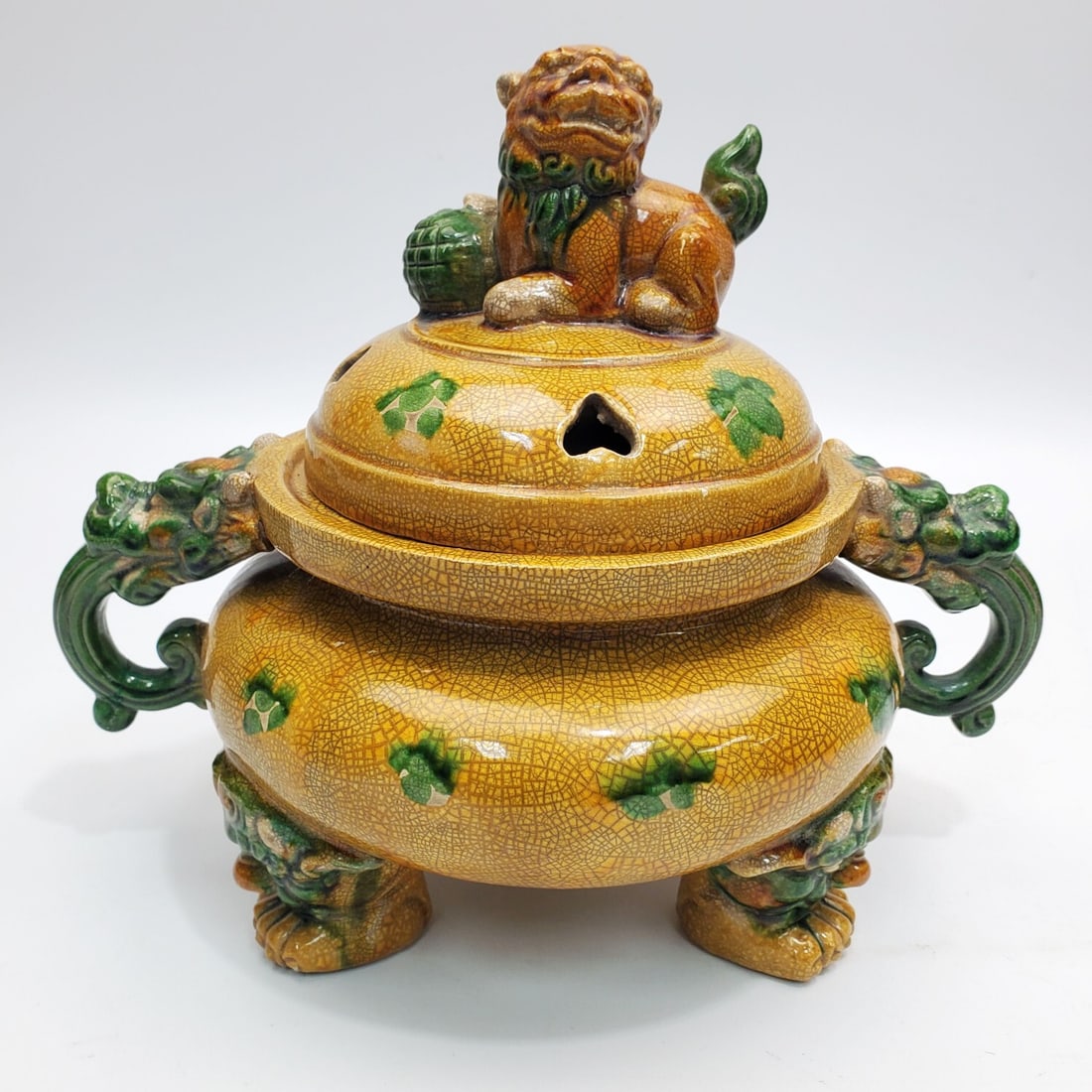 Chinese Signed Yellow Glaze Pottery Censer: Chinese Signed Tang Sancai Yellow Glaze Pottery Censer Incense Burner w/ Foo Dog Finial & Dragon Handles. In Original Fitted Box. Condition: Generally Very Good. Dimensions: L-9" x H-7.5". Box-L-13" x