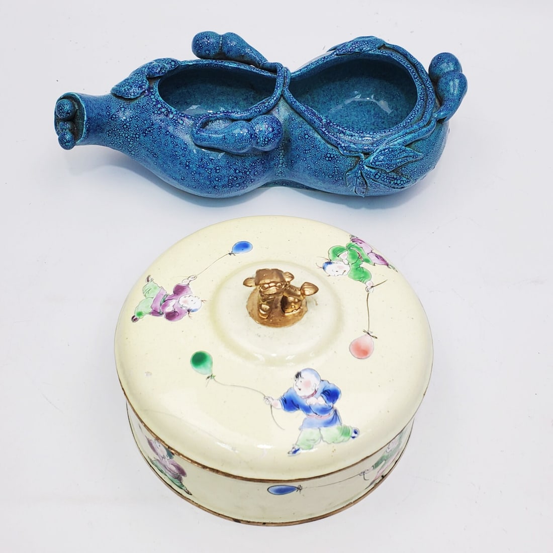 Lot of 2 Chinese Items: Lot of 2 Chinese Items Including a Blue Glazed Pear-Shaped Porcelain Brush Washer & an Enameled Brass Box. Condition: Generally Good. Dimensions: Larger L-8.25" x W-4.25" x H-2". Provenance: From a Lo