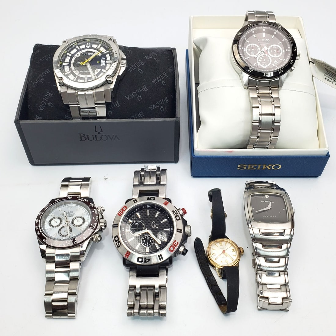 Group Lot of 6 Watches: Group Lot of 6 Watches Including a Bulova Precisionist In Original Box, a Seiko Chronograph in Original Box (Unused) & Others. Condition: Generally Good, As Found. Please Note- We Do Not Guarantee the