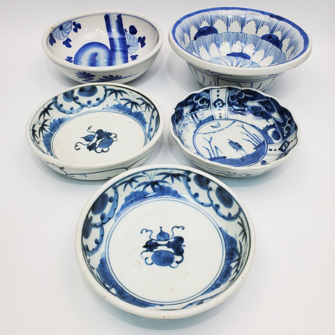 Lot of 5 Japanese Blue & White Porcelain Bowls: Group Lot of 5 Japanese Blue & White Porcelain Bowls. Condition: Generally Good. Dimensions: Largest-Dia-8" x H-3". Provenance: From a Long Island, NY Home. Please note the absence of a Condition Repo