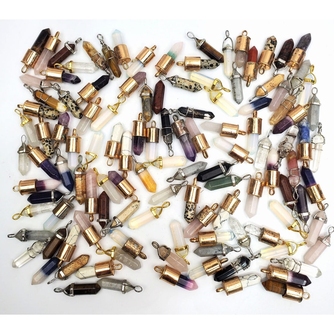 Large Bag Lot of Various Gemstone Point Pendants: Very Large Bag Lot of Various Gemstone Point Pendants. Condition: Generally Very Good. Dimensions: Various Sizes. Provenance: From a Long Island, NY Home. Please note the absence of a Condition Report
