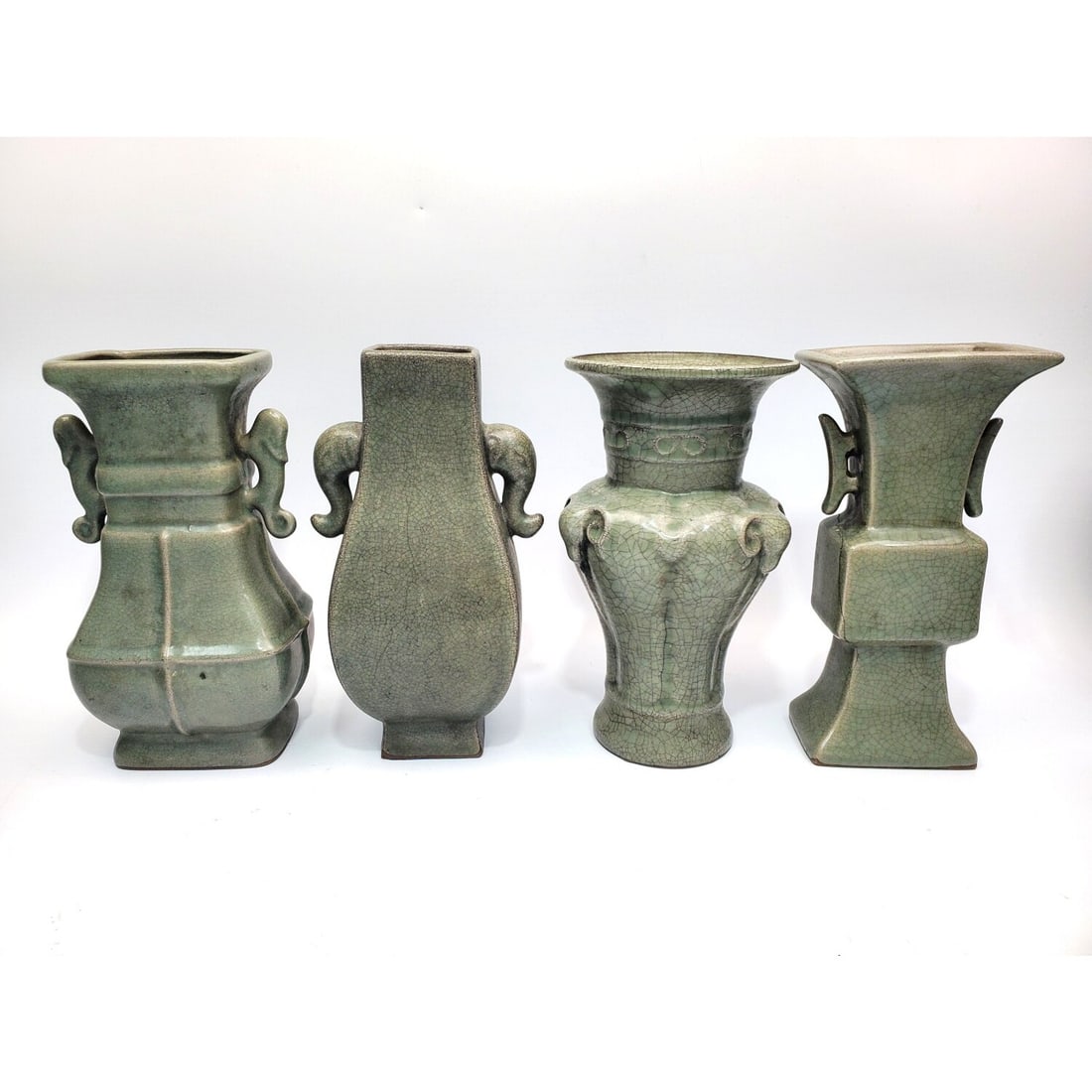 Lot of 4 Signed Chinese Celadon Porcelain Vases: Lot of 4 Signed Chinese Celadon Porcelain Vases. Condition: 3 Are Generally Good. 1 Has a Crack & a Chip. Dimensions: Tallest-H-9". Provenance: From a Long Island, NY Home. Please note the absence of 