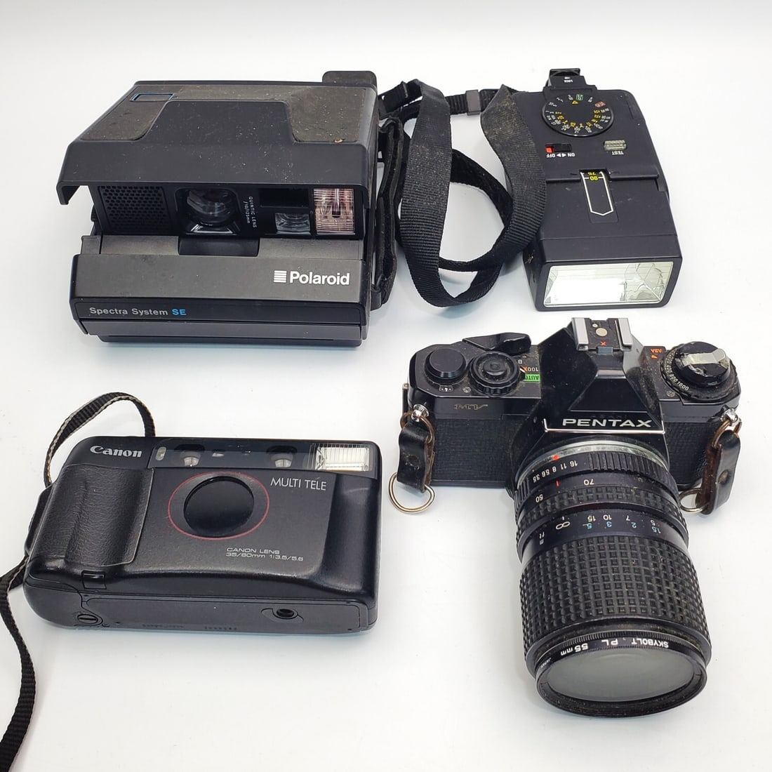 Lot of 4 Vintage Cameras: Lot of 4 Vintage Cameras Including Pentax MV. Condition: As Found. Please Note- We Do Not Guarantee the Workability of Any Cameras. Dimensions: Various Sizes. Provenance: From a Long Island, NY Home. 