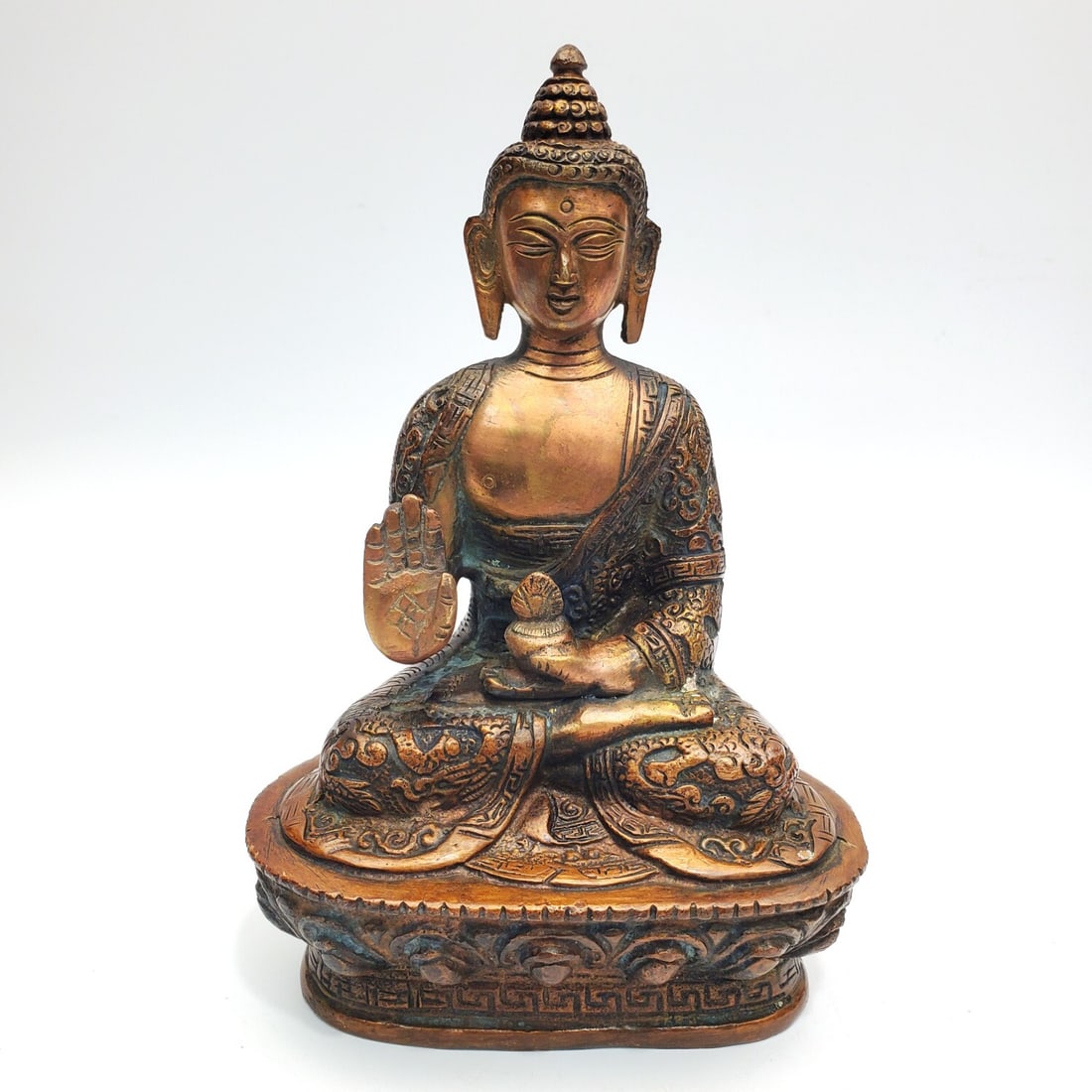 East Asian Bronze Buddha Figure: East Asian Bronze Buddha Figure. Condition: Generally Very Good. Dimensions: H-7" x L-4.5" x W-3". Provenance: From a Long Island, NY Home.Please note the absence of a Condition Report does not imply 