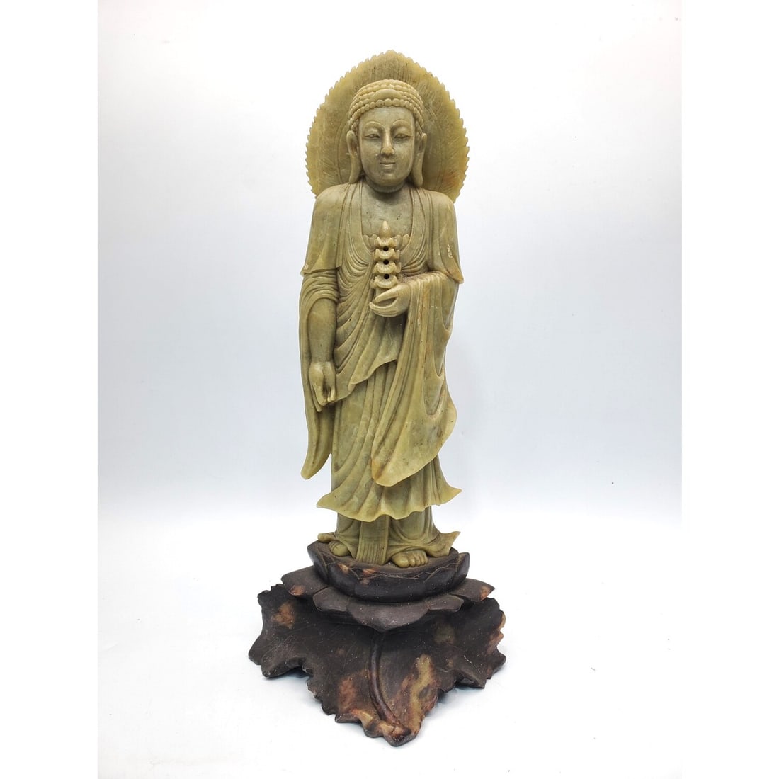 Chinese Antique Carved Soapstone Buddha Statue: Chinese Antique Carved Soapstone Statue of a Buddha On a Lotus Base.Condition: Generally Very Good. Dimensions: Total H-14". Provenance: From a Long Island, NY Home.Please note the absence of a Condit