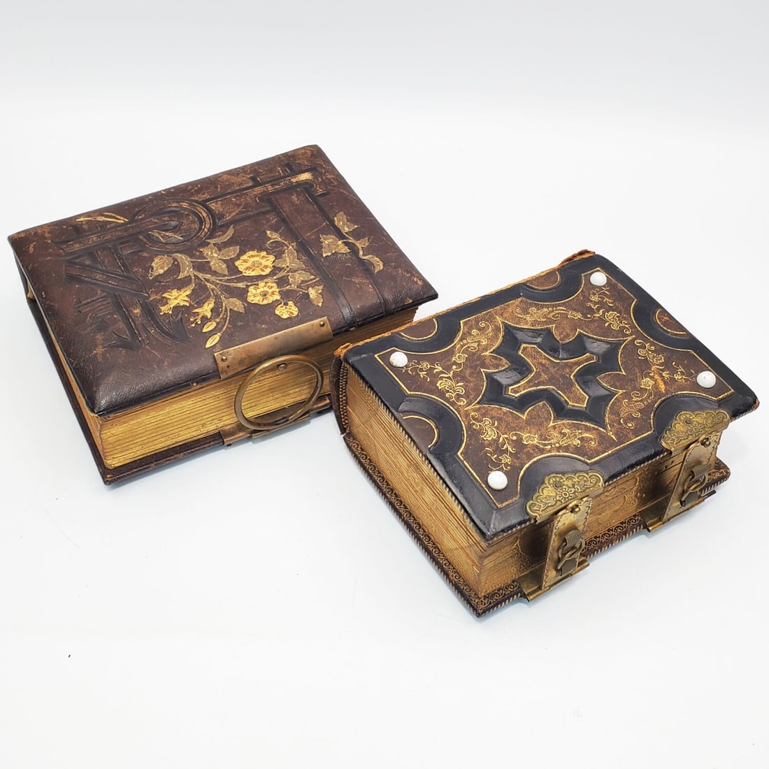 2 Antique Victorian Leather Bound Photo Albums: Lot of 2 Antique Victorian Leather Bound Family Photo Albums w/ Tin Type Photos Inside. One is Dated 1804. Condition: As Found. Dimensions: Larger-6.5" x 5" x 3". Provenance: From a Long Island, NY Ho