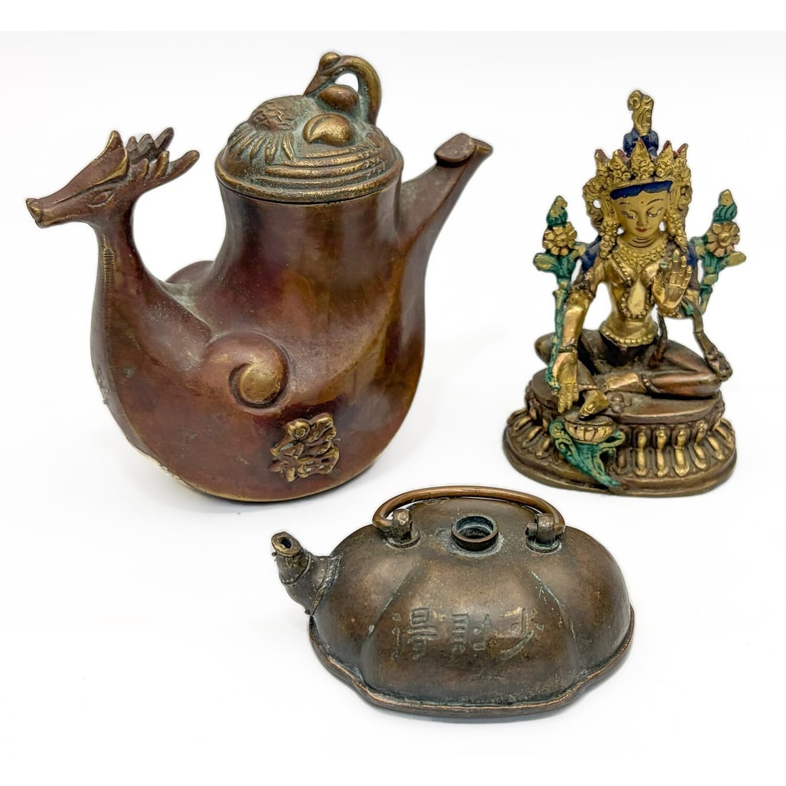 Chinese Lot of 3 Bronze Items: Chinese Lot of 3 Bronze Items Including a Figure & 2 Tea Pots. Condition: Generally Good. Dimensions: Largest-H-4.75" x L-5". Provenance: From a Long Island, NY Home. Please note the absence of a Cond