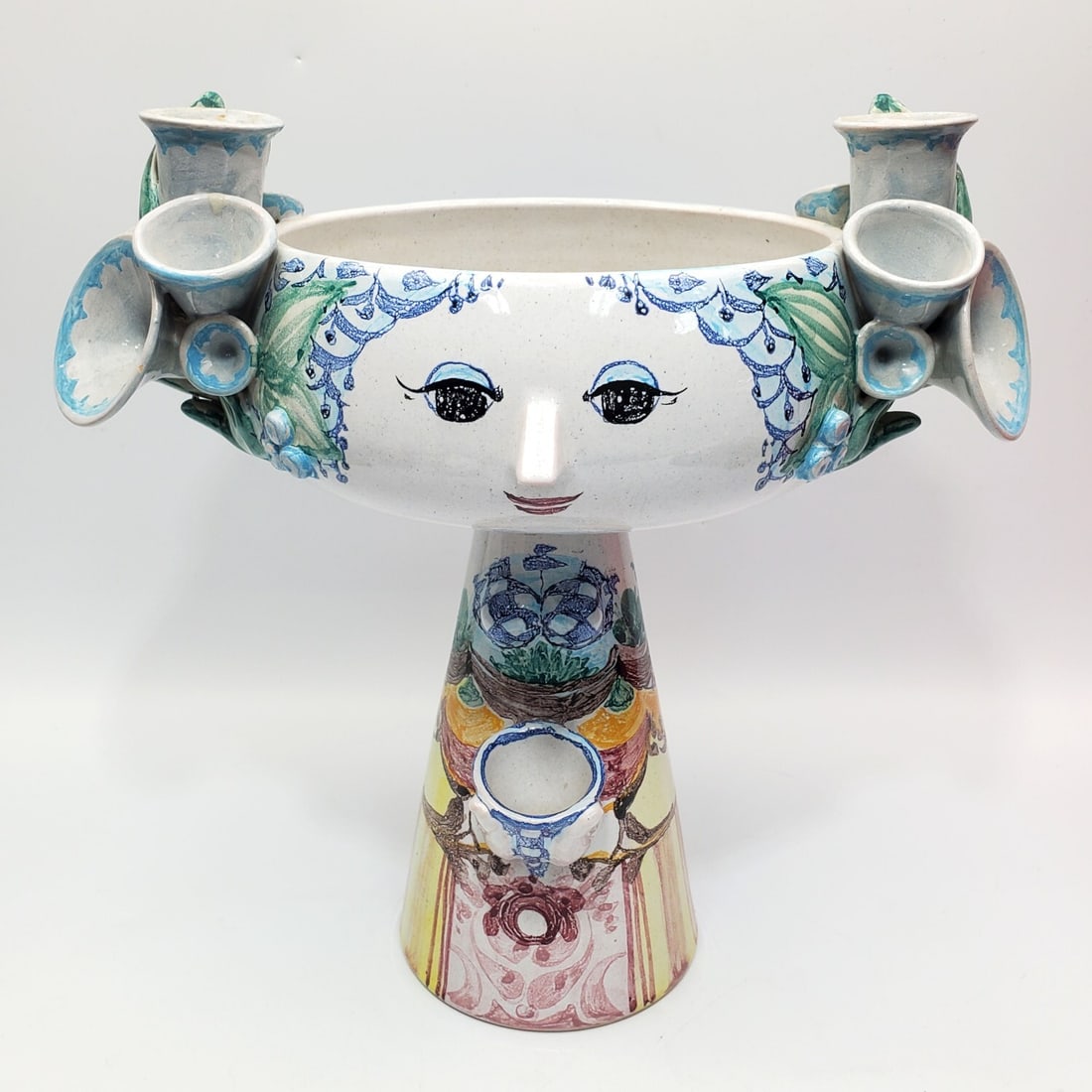 Bjorn Wiinblad, Danish (1918-2006) "Eva" Bowl: Bjorn Wiinblad, Danish (1918-2006) Pottery Center Bowl "Eva". c.1979. Fully Marked. Condition: One Piece is Broken Off. As Found. Sold As Is. Dimensions: H-11.5" x L-11.5". Provenance: From a Long