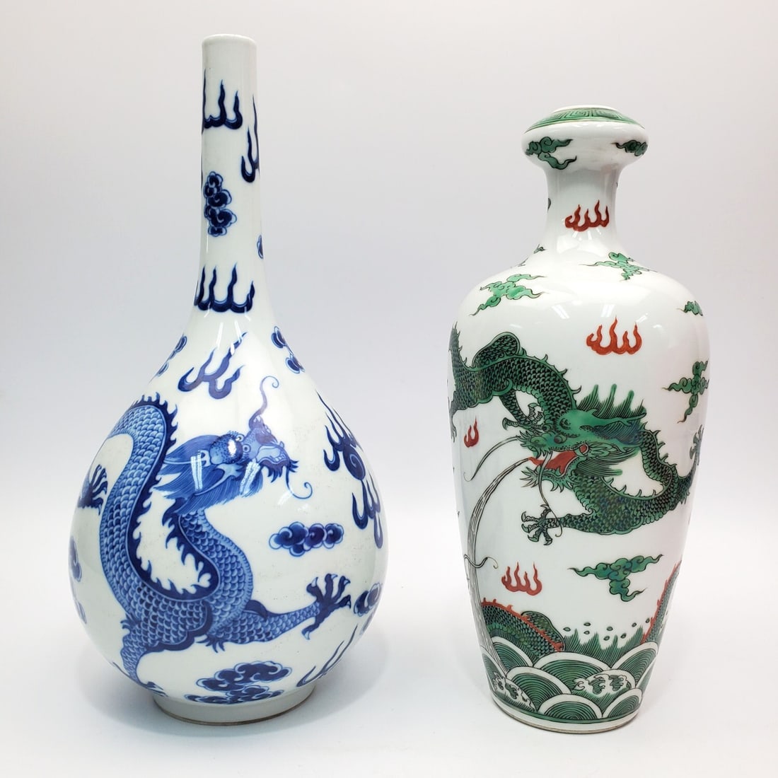 Lot of 2 Chinese Porcelain Vases Depicting Dragons: Lot of 2 Chinese Porcelain Vases Depicting Dragons. 1 is Signed. Condition: Generally Good. Dimensions: Taller-H-10.8". Provenance: From a Long Island, NY Home. Please note the absence of a Condition 